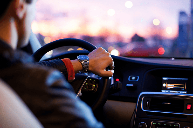 A car owner sitting proudly inside their vehicle, highlighting the opportunity for private individuals to offer their cars for road tests on Road-Test.ca.